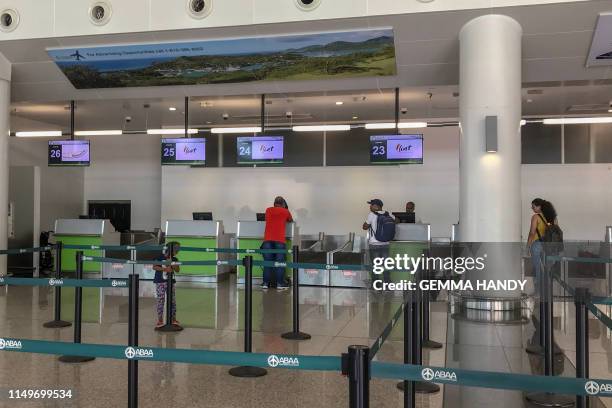 Departure desk is viewed at the V.C. Bird International Airport on June 13, 2019 in Saint John's, Antigua. - A Caribbean airline that helps bind...