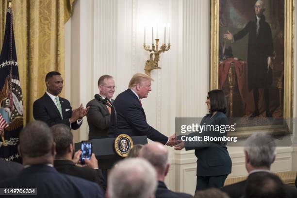 Reality star and activist Kim Kardashian West, right, shakes hands with U.S. President Donald Trump before speaking about a second chance hiring and...