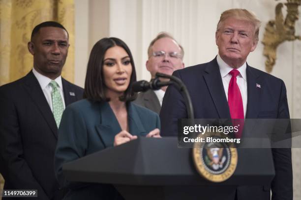 President Donald Trump, right, listens as reality star and activist Kim Kardashian West speaks about a second chance hiring and re-entry initiative...