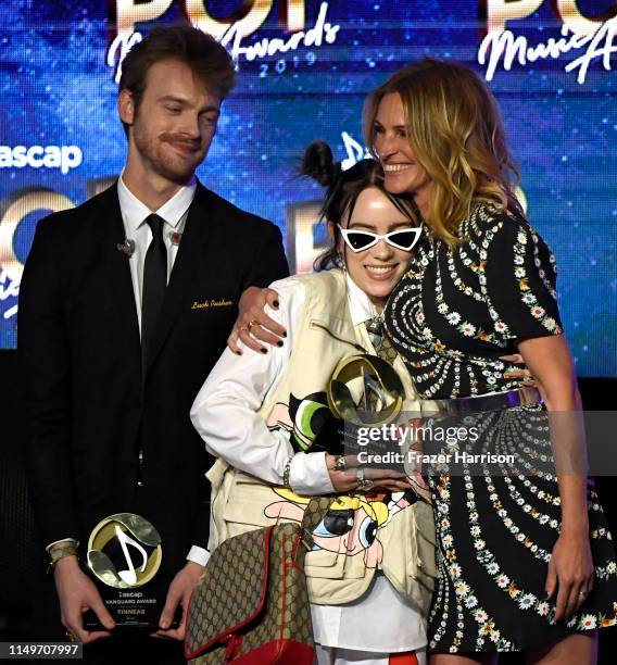 And Billie Eilish accept the Vanguard Award from Julia Roberts onstage during the 36th annual ASCAP Pop Music Awards at The Beverly Hilton Hotel on...