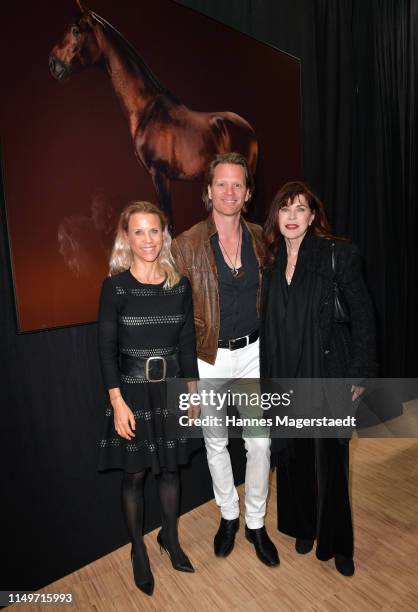 Florentine Rosemeyer, Mike Kraus and Anja Kruse attend the "Veneration" exhibition opening in cooperation with photographer Mike Kraus on May 16,...