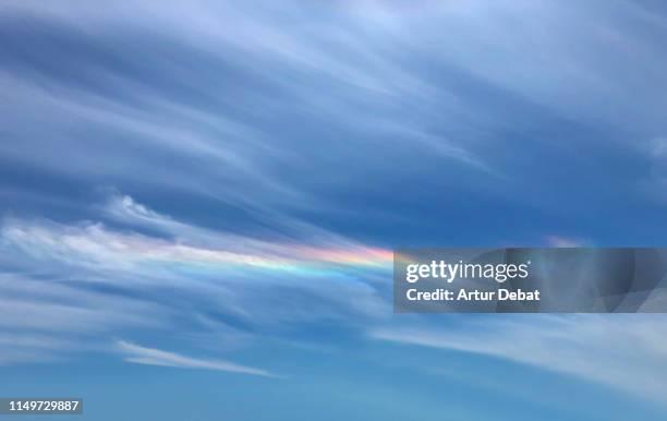 colorful iridescence in the sky during windy day. - iridescent stock-fotos und bilder