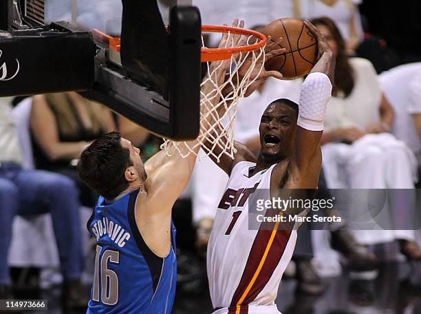 Chris Bosh of the Miami Heat goes up for a shot against Peja Stojakovic of the Dallas Mavericks in the second quarter in Game One of the 2011 NBA...