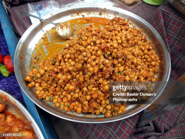 people are buying things for iftar - aloo tikki stock pictures, royalty-free photos & images