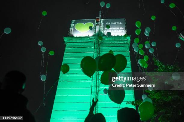 People release balloons in front of Grenfell Tower during a vigil to mark the second anniversary of the fire, on June 13, 2019 in London, England. A...