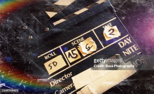 distressed image of movie clapperboard - film set stock pictures, royalty-free photos & images