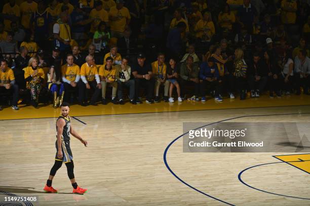 Stephen Curry of the Golden State Warriors smiles and walk up court against the Toronto Raptors during Game Six of the NBA Finals on June 13, 2019 at...