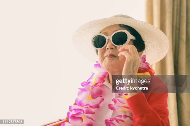 senior woman' vacation mood - old lady eating ice cream stock pictures, royalty-free photos & images