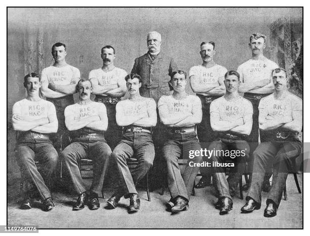 antique photo: city of belfast royal irish constabulary tug-of-war team - sports team stock illustrations