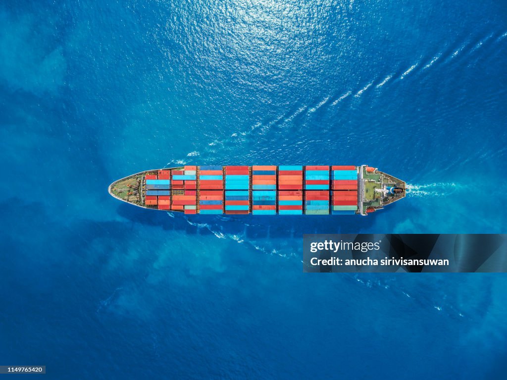 Aerial top view container ship Park for import export logistics in pier, thailand.