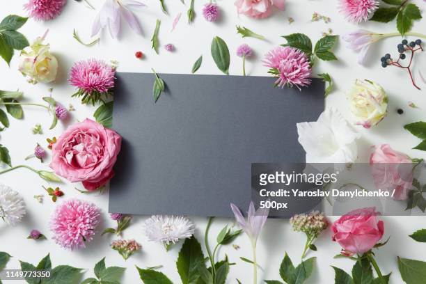 beautiful pink and white flowers with empty notebook - notepad white table foto e immagini stock