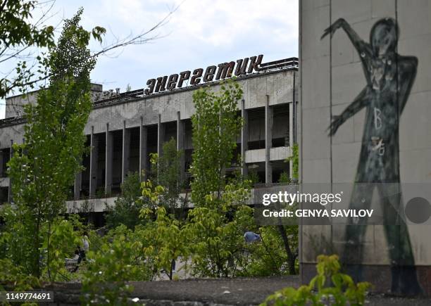 Picture taken on June 7 shows a graffiti in the ghost city of Pripyat in the Chernobyl exclusion zone on June 7, 2019. - HBOs hugely popular...