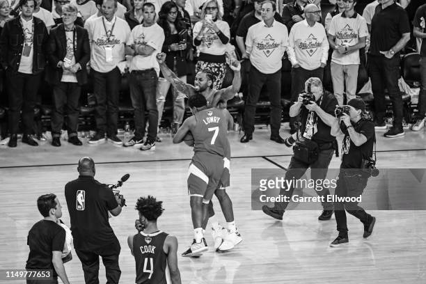 Kawhi Leonard and Kyle Lowry of the Toronto Raptors yell and celebrate on court after winning Game Six of the NBA Finals against the Golden State...