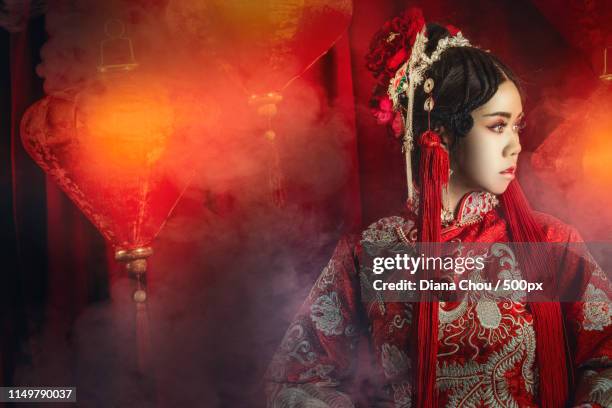 chinese girl in traditional wedding costume - fairytale wedding stock pictures, royalty-free photos & images