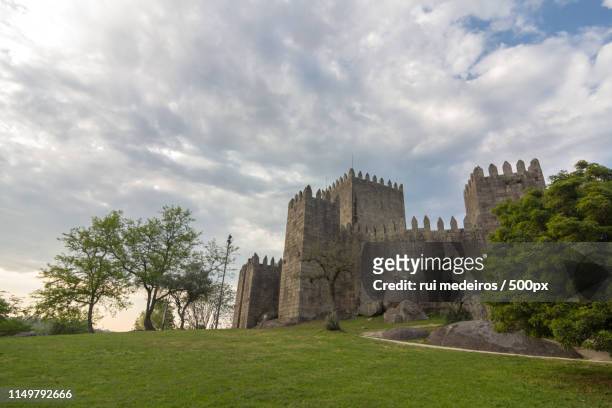 castle of guimarães - guimarães stock pictures, royalty-free photos & images