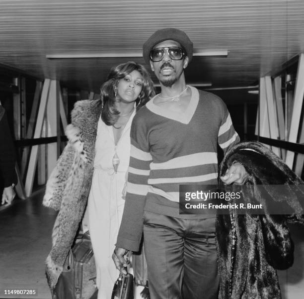 American musician Ike Turner and American singer-songwriter Tina Turner at Heathrow Airport, London, UK, 27th October 1975.