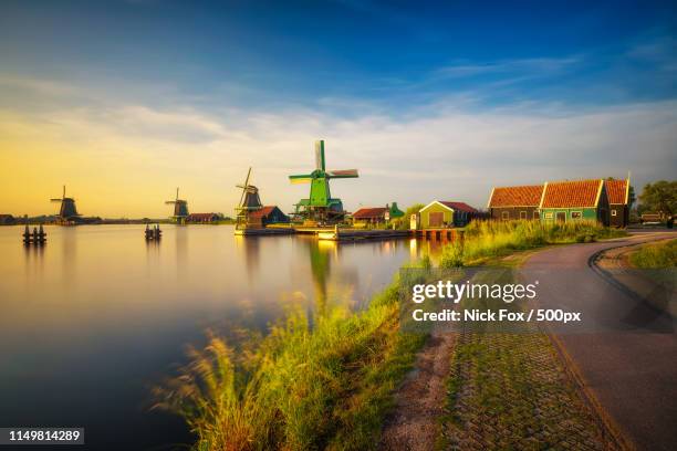 sunset at zaanse schans - amsterdam windmill stock pictures, royalty-free photos & images