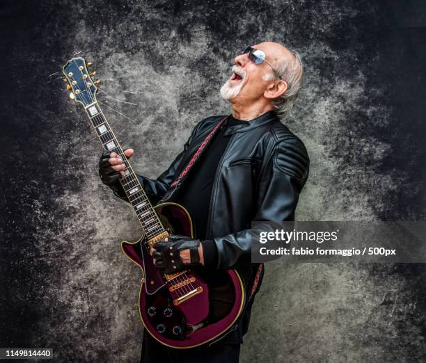 eccentric senior man portrait - funny rock star stock pictures, royalty-free photos & images