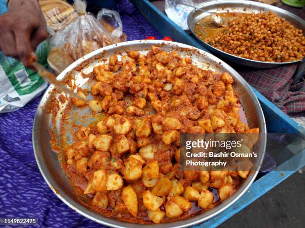 people are buying things for iftar - aloo tikki stock pictures, royalty-free photos & images
