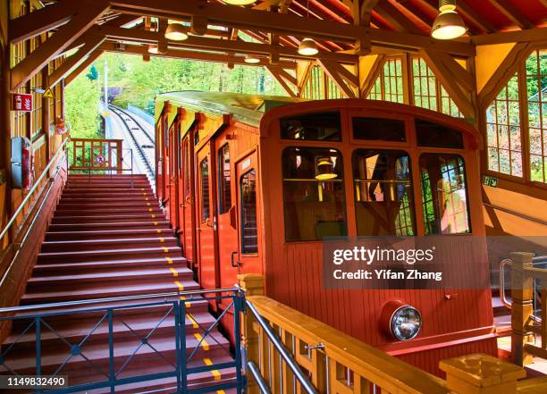 a view of tram from heidelberg castle to the top of the hill - heidelberg germany fotografías e imágenes de stock