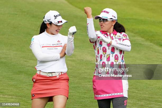 Sakura Koiwai and Minami Katsu of Japan share a laugh on the 17th hole during the first round of the Hoken-no-Madoguchi Ladies at Fukuoka Country...