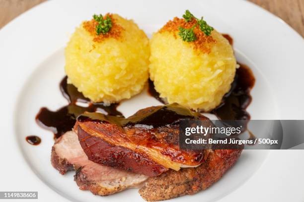 bavarian roasted pork with dumplings - pork shoulder stock pictures, royalty-free photos & images