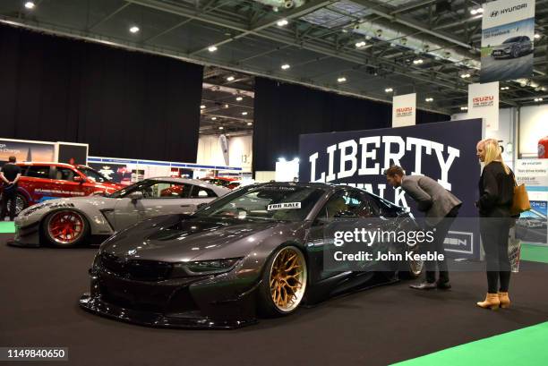 I8 prepared by Liberty Walk automotive tuning company is displayed during the London Motor and Tech Show at ExCel on May 16, 2019 in London, England....