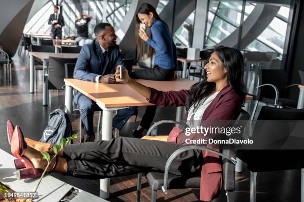 beautiful indian woman texting during the seminar break - asian women feet stock pictures, royalty-free photos & images