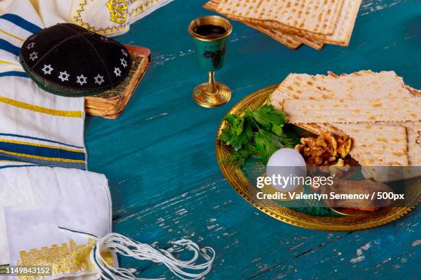 matzoh, silver seder plate and wine for jewish passover - seder plate stock pictures, royalty-free photos & images