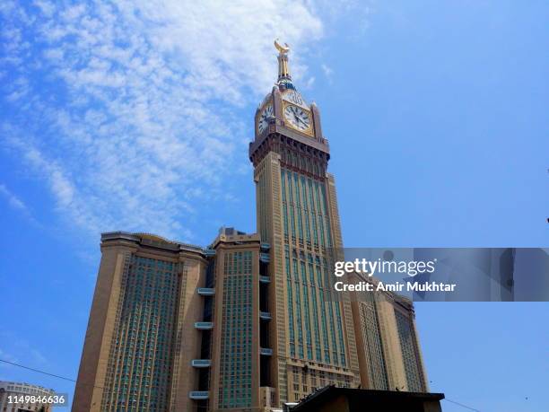 clock tower building in mecca (makah) city, saudi arabia - royalty stock-fotos und bilder