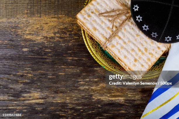 passover matzoh jewish holiday bread over wooden table - kosher symbol stock pictures, royalty-free photos & images