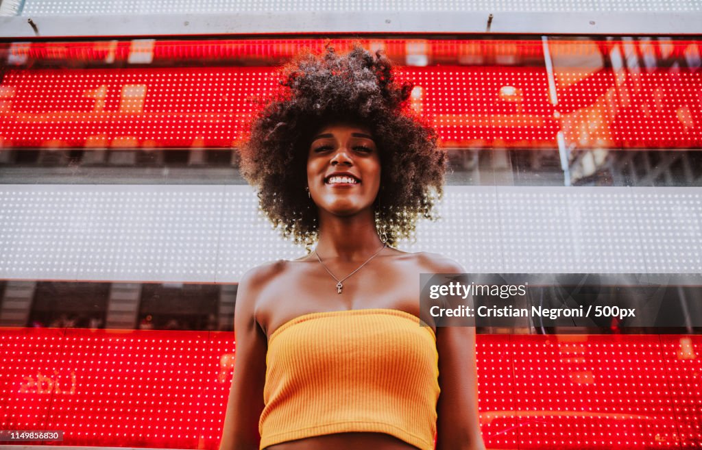 Young Beautiful Girl Walking In Time Square, Manhattan Lifestyl