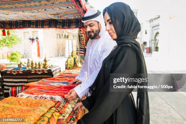 arabian couple dating in dubai - middle east market stock pictures, royalty-free photos & images