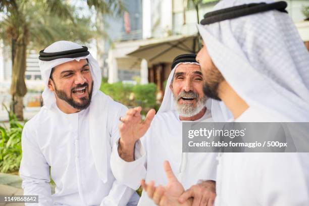 group of businessmen in dubai - middle east friends stock pictures, royalty-free photos & images