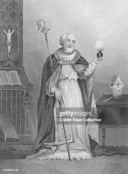 Engraving depicting Saint Augustine of Hippo , philosopher and theologian, stands holding a flaming heart and a shepherd's crook, circa 420....