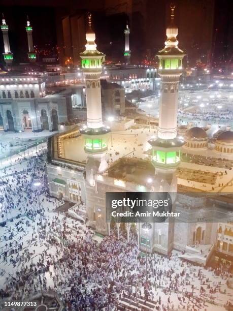pilgrims worshiping in mecca for umrah and prayer - pilgrimage stock pictures, royalty-free photos & images