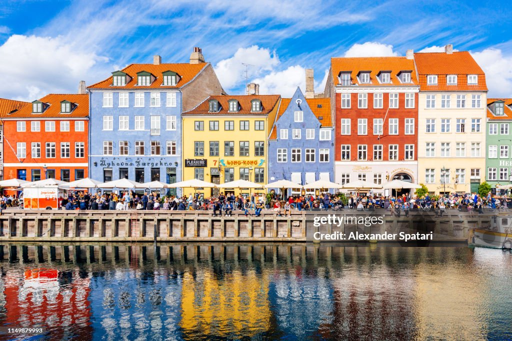 Multicolored houses along the canal in Nyhavn harbor, Copenhagen, Denmark