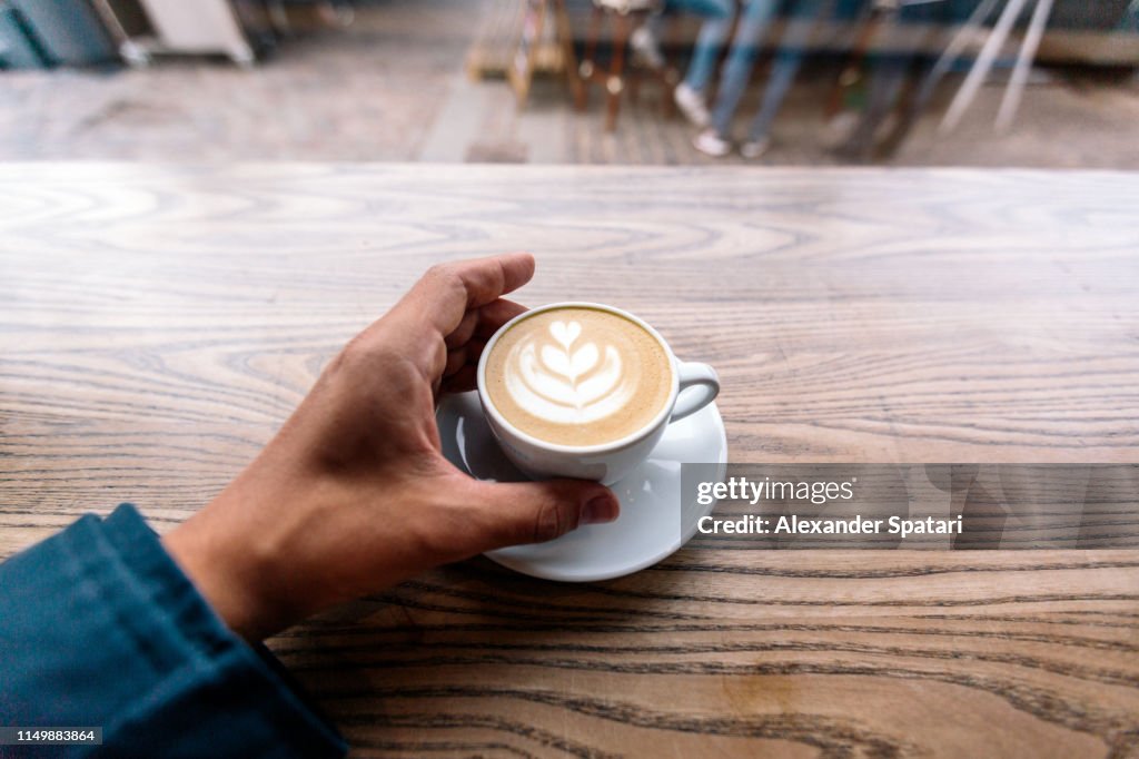 Drinking cappuccino, first person view