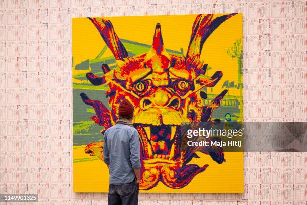 Visitors look at the "Zodiac" series LEGO portrait series made by Chinese artist and political activist Ai Weiwei during opening of exhibition at the...