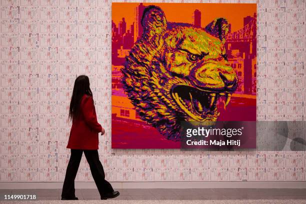 Visitors looks at the "Zodiac" series LEGO portrait series made by Chinese artist and political activist Ai Weiwei during opening of exhibition at...