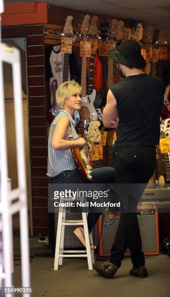 Katie Waissel sighted with a friend shopping for a guitar on Denmark St on June 1, 2011 in London, England.
