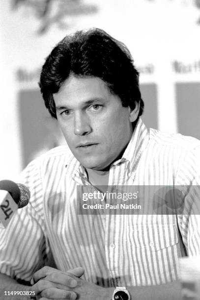 American Country musician George Strait sits behind a microphone during a press conference, Fresno, California, April 19, 1985.