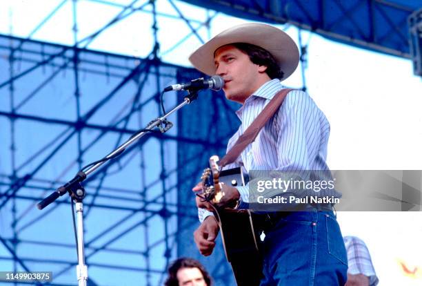 American Country musician George Strait plays guitar as he performs onstage at Chicagofest, Chicago, Illinois, August 30, 1985.