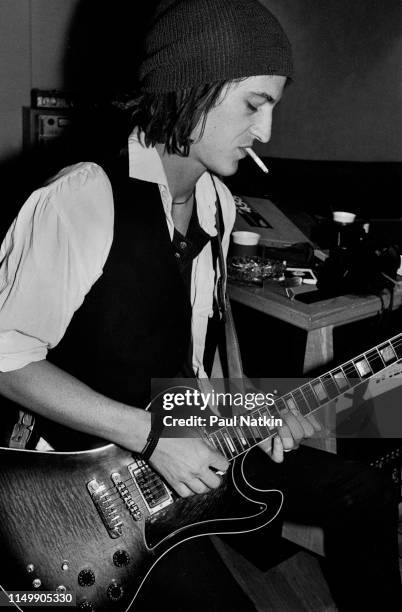 American Rock musician Izzy Stradlin plays guitar during a studio session with his band, Izzy Stradlin and the Ju Ju Hounds, at the Chicago Recording...
