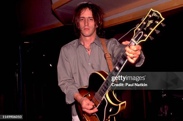 American Rock musician Izzy Stradlin plays guitar during a studio session with his band, Izzy Stradlin and the Ju Ju Hounds, at the Chicago Recording...