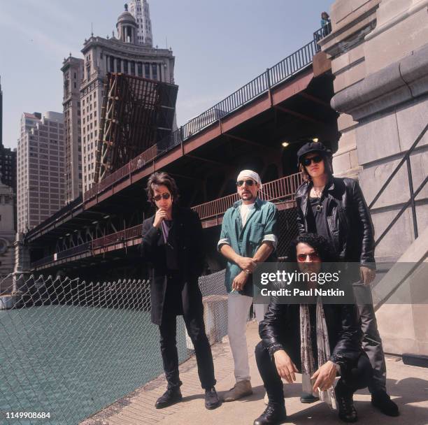 Portrait of American Rock group Izzy Stradlin and the Ju Ju Hounds beside the Chicago River , Chicago, Illinois, May 10, 1992. Pictured are, from...