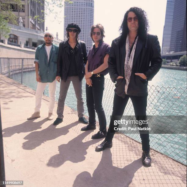 Portrait of American Rock group Izzy Stradlin and the Ju Ju Hounds on the bank of the Chicago River, Chicago, Illinois, May 10, 1992. Pictured are,...