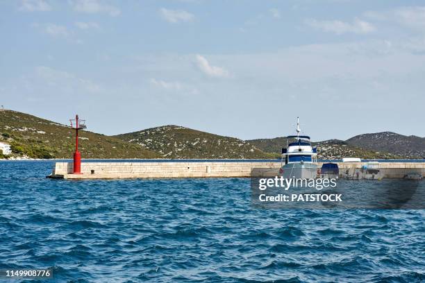 boats moored in n tisno, murter island, croatia - tisno stock pictures, royalty-free photos & images