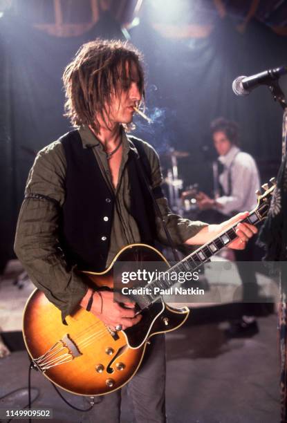 American Rock musician Izzy Stradlin plays guitar with his band, Izzy Stradlin and the Ju Ju Hounds, during a video shoot, Chicago, Illinois, May 15,...