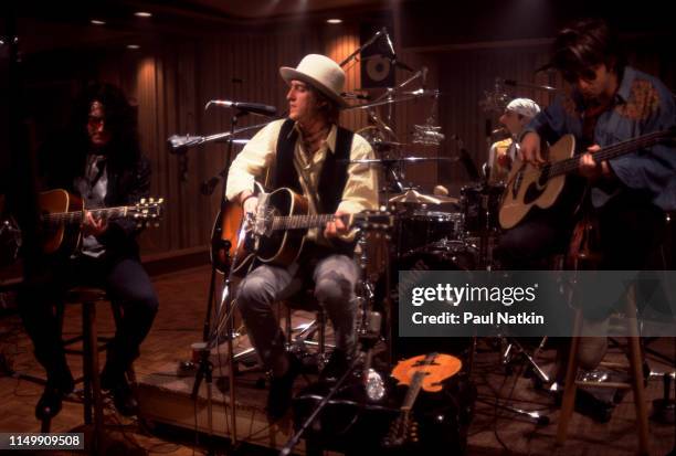 American Rock group Izzy Stradlin and the Ju Ju Hounds perform during a video shoot, Chicago, Illinois, May 15, 1992. Pictured are, from left, Rick...